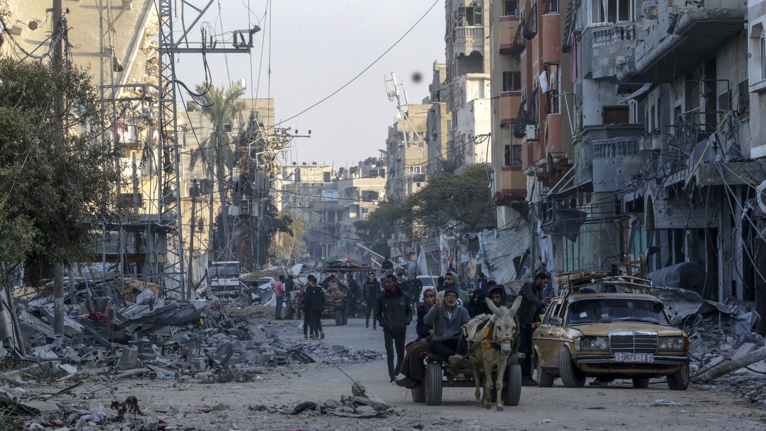 epa11090409 Destroyed houses and buildings during Israeli military operation in Al Maghazi refugee camps in the south of the Gaza Strip, January 19, 2024. More than 24,400 Palestinians and at least 1,300 Israelis...
