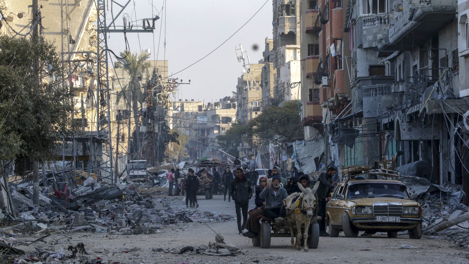 epa11090409 Destroyed houses and buildings during Isreali military operation in Al Maghazi refugee camps in southern Gaza Strip, 19 January 2024. More than 24,400 Palestinians and at least 1,300 Israe ...