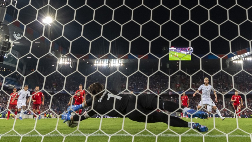 Switzerland's goalkeeper Yann Sommer blocks a penalty shot during the 2022 FIFA World Cup European Qualifying Group C match between Switzerland and Italy in the St. Jakob-Park stadium in Basel, Switze ...