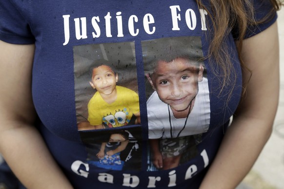 FILE - In this April 7, 2016, file photo, a friend of the family of Gabriel Fernandez, an 8-year-old boy who died in 2013, wears a shirt with his likeness in Los Angeles. A Southern California mother  ...