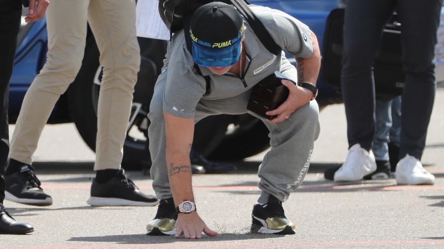 epa06893100 Argentinian soccer legend Diego Maradona reacts upon his arrival at Brest airport, Belarus, 16 July 2018. Maradona has been appointed as chairman of Belarussian soccer club &#039;Dinamo Br ...