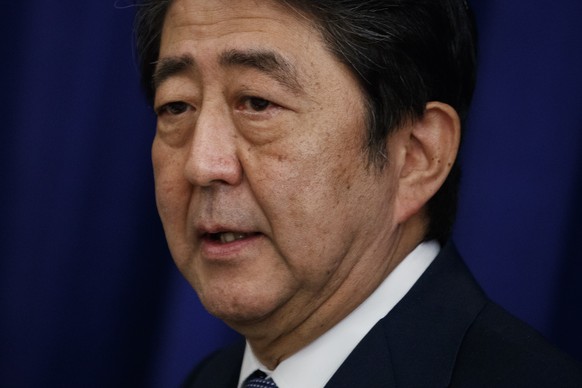 Japanese Prime Minister Shinzo Abe speaks at a luncheon with President Donald Trump and South Korean President Moon Jae-in at the Palace Hotel during the United Nations General Assembly, Thursday, Sep ...