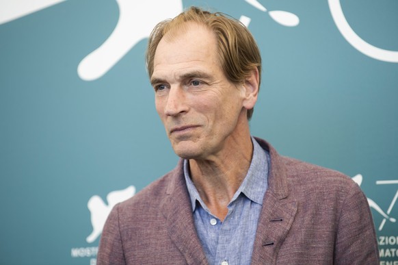FILE - Actor Julian Sands poses for photographers at the Venice Film Festival in Venice, Italy, on Sept. 3, 2019. Authorities say the latest search for missing actor Julian Sands on Southern Californi ...