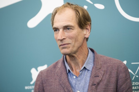 FILE – Actor Julian Sands poses for photographers at the Venice Film Festival in Venice, Italy, on Sept. 3, 2019. Authorities say the latest search for missing actor Julian Sands in Southern California…