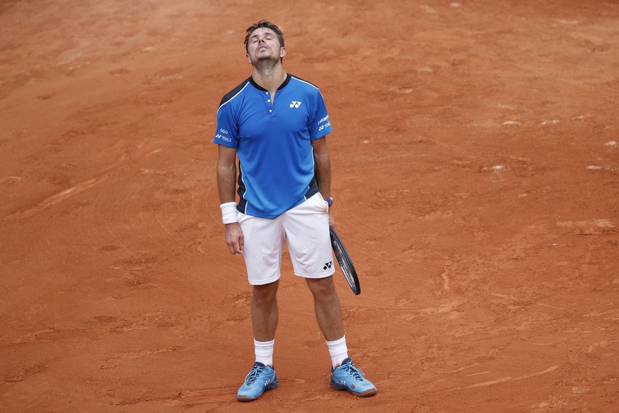 Switzerland&#039;s Stan Wawrinka misses a return against Spain&#039;s Guillermo Garcia-Lopez during their first round match of the French Open tennis tournament at the Roland Garros stadium in Paris,  ...