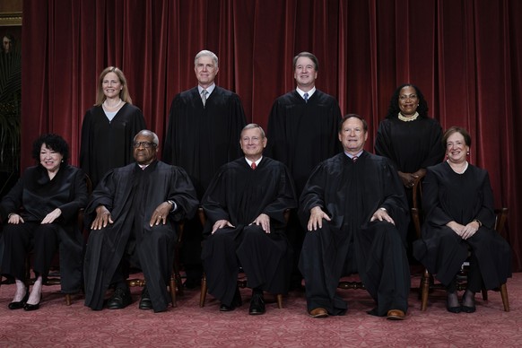 FILE - Members of the Supreme Court sit for a new group portrait following the addition of Associate Justice Ketanji Brown Jackson, at the Supreme Court building in Washington, Oct. 7, 2022. Bottom ro ...