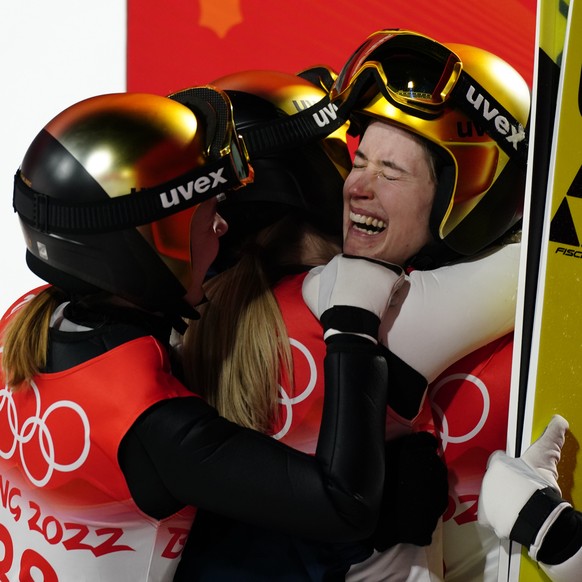 epa09729849 Ursa Bogataj of Slovenia (R) celebrates winning after the Women&#039;s Ski Jumping Normal Hill final at the Zhangjiakou National Ski Jumping Centre at the Beijing 2022 Olympic Games, Zhang ...