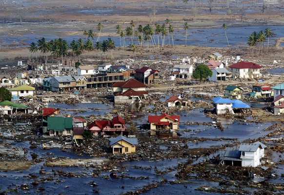 epa11790657 (FILE) - An aerial view taken from a helicopter shows damage in tsunami-hit city of Banda Aceh, Indonesia, 20 January 2005 (reissued 23 December 2024). December 2024 marks the 20th anniver ...