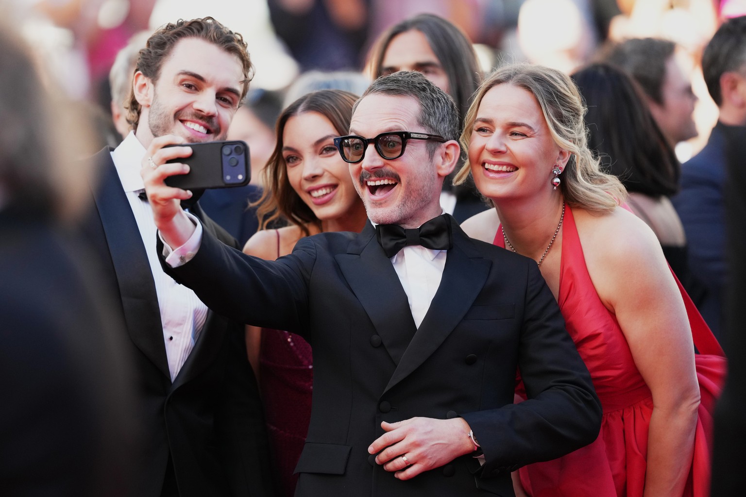 Elijah Wood, centre, takes a selfie photogragh with William Jackson, from left, Katie Jackson and Mette-Marie Kongsved at the opening ceremony and premiere of the film 'The Electric Kiss' du ...