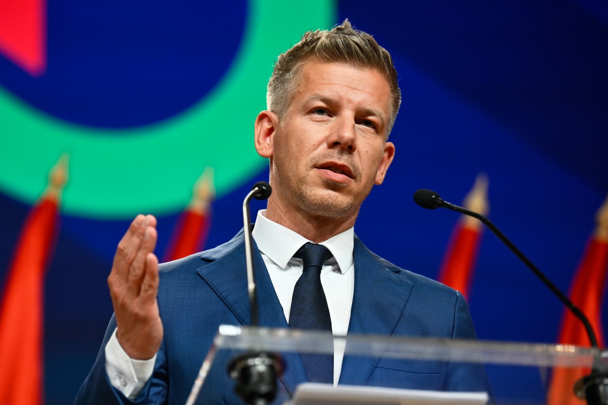 Peter Magyar gestures as he speaks to the media in Budapest, Hungary, Monday, April 13, 2026, after defeating Prime Minister Viktor Orban's party in the country's parliamentary elections. (A ...