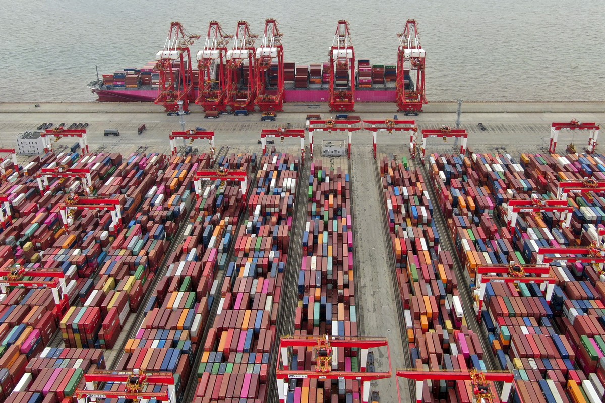 FILE - The Yangshan container port is seen in an aerial view in Shanghai, China on July 10, 2021. China?s exports tumbled in June, 2023, by 12.4% compared with a year earlier amid weaker global demand ...