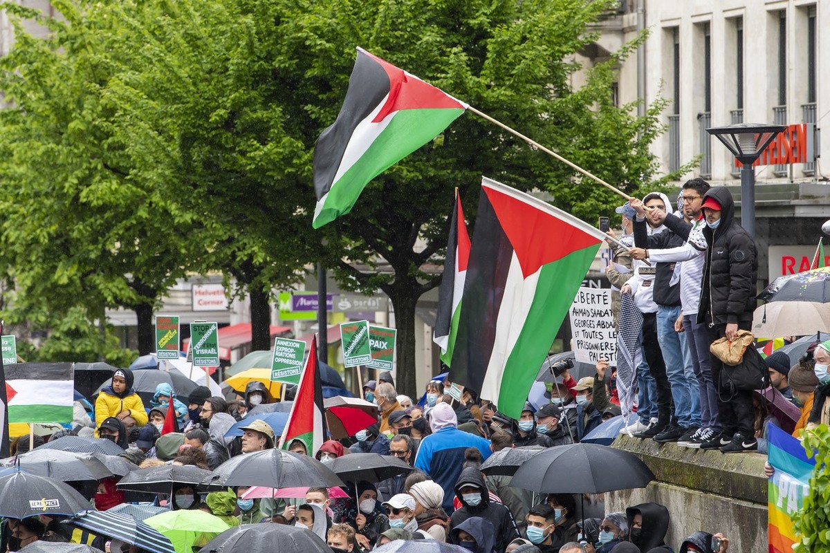People participate at a demonstration of solidarity with the Palestinian people, in Geneva, Switzerland, Saturday, May 15, 2021. Protesters called for a free Palestine in response to days of violent c ...