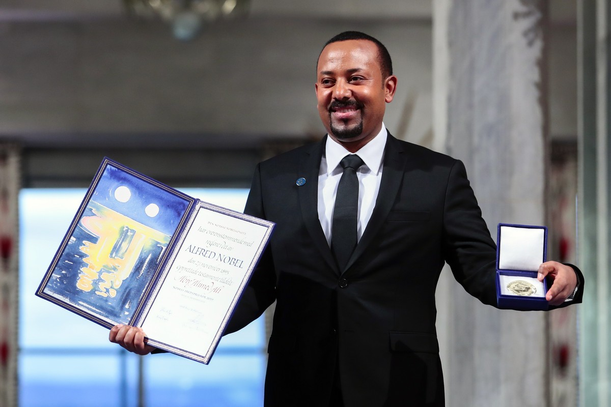 FILE - In this Tuesday, Dec. 10, 2019, file photo, Ethiopia's Prime Minister Abiy Ahmed poses for the media after receiving the Nobel Peace Prize during the award ceremony in Oslo City Hall, Norw ...