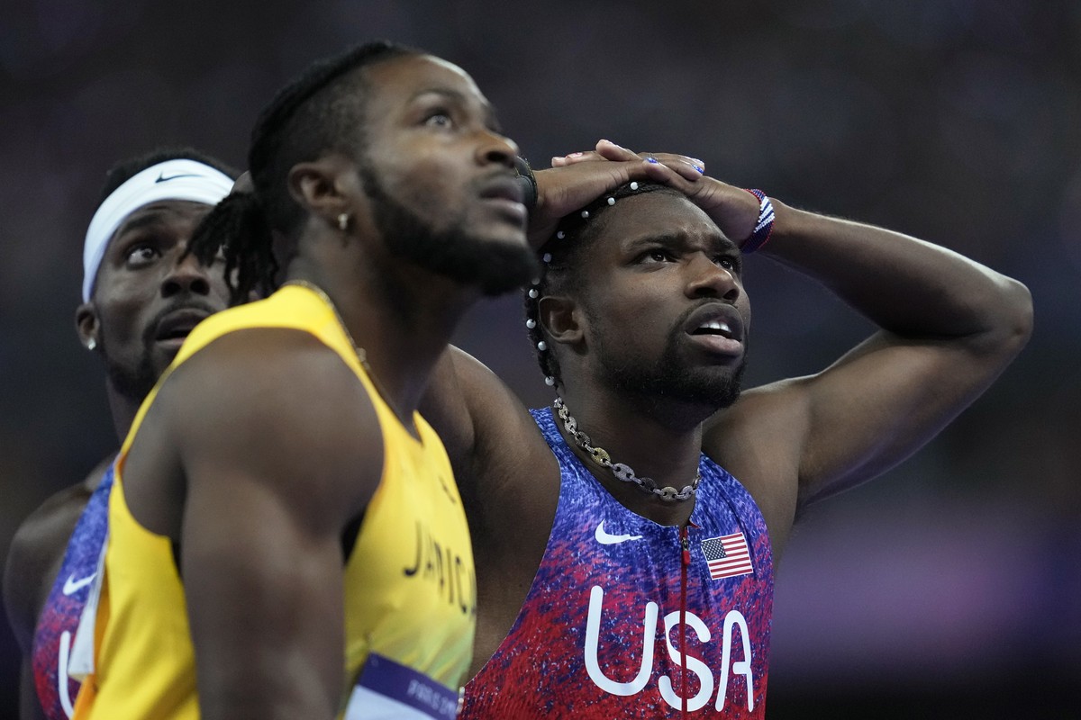 Kishane Thompson, of Jamaica, Noah Lyles, of the United States, right, and Fred Kerley, of the United States, left, wait for the official results after finishing the men's 100 meters final at the ...