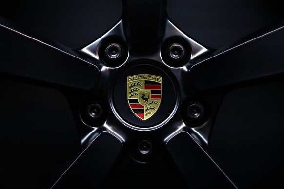 epa11944069 A Porsche wheel center cap is seen at the showroom of Porsche Exclusive Manufaktur in Stuttgart, Germany, 06 March 2025. Porsche AG will present the results for the 2024 financial year on  ...