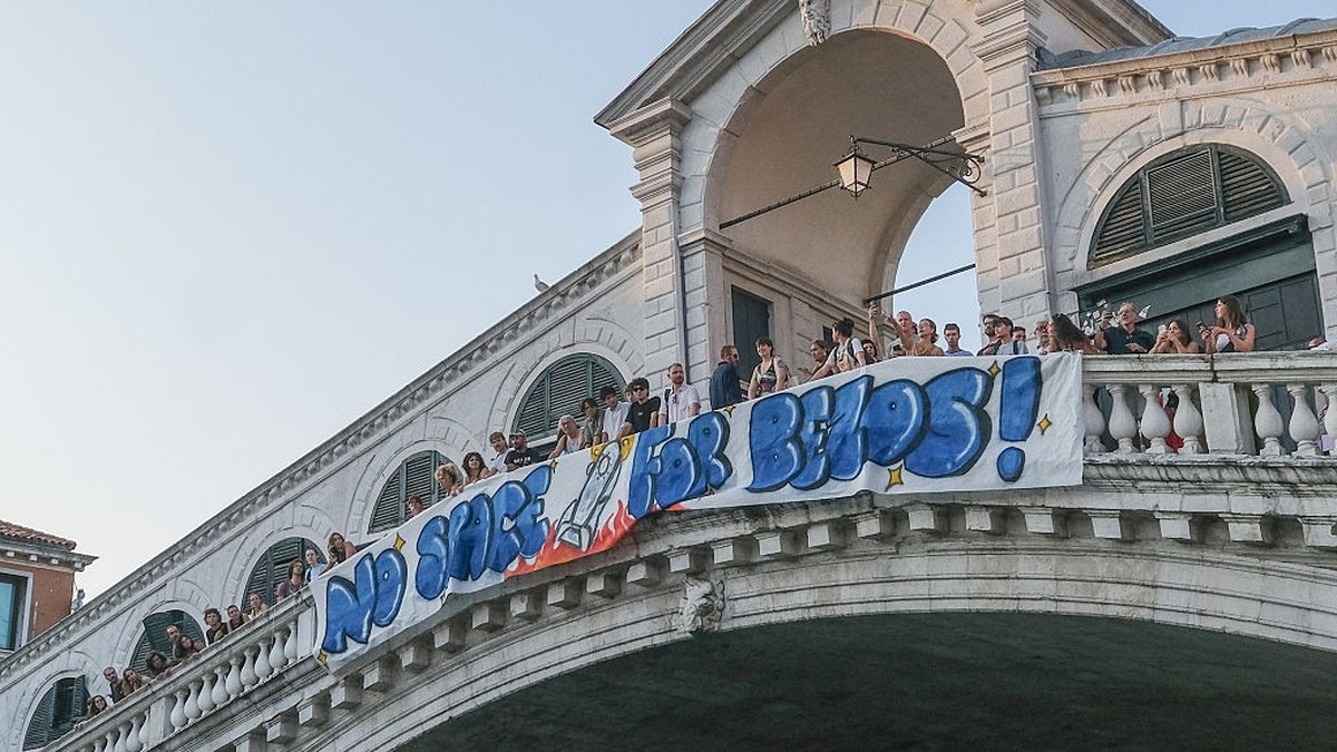 VENICE, ITALY - JUNE 13: Activists of “No Space For Bezos” displayed a banner on the Rialto Bridge to protest the wedding to be held in Venice from 26 to 28 June 2025 on June 13, 2025 in Venice, Italy ...