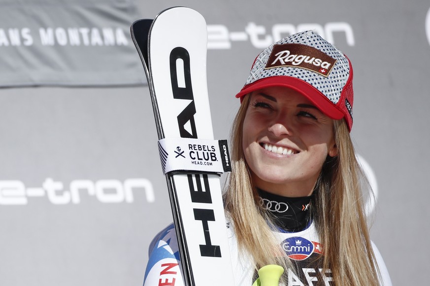 Switzerland's Lara Gut-Behrami smiles after winning an alpine ski, women's World Cup downhill, in Crans Montana, Switzerland, Saturday, Feb. 22, 2020. (AP Photo/Gabriele Facciotti)