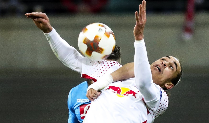 epa06554992 Leipzig&#039;s Yussuf Poulsen (front) in action against Napoli&#039;s Lorenzo Tonelli (back) during the UEFA Europa League round of 32, second leg soccer match between RB Leipzig and SSC N ...