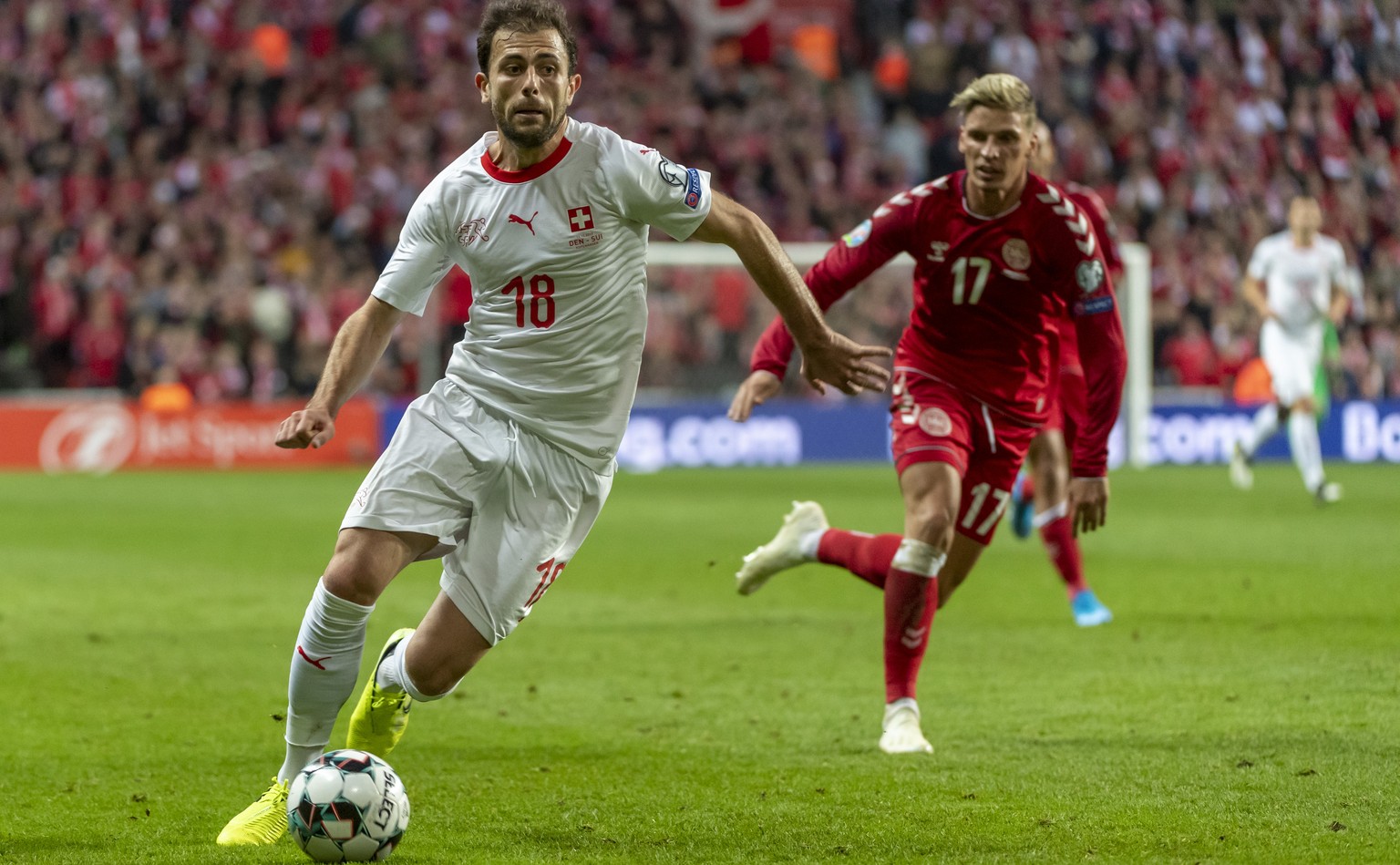 Switzerland&#039;s Admir Mehmedi, left, fights for the ball against Denmark&#039;s Jens Stryger Larsen, right, during the UEFA Euro 2020 qualifying Group D soccer match between Denmark and Switzerland ...