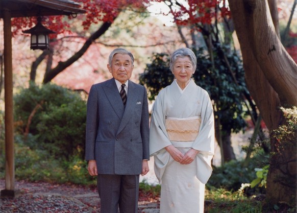 In this photo taken on Monday, Nov. 29, 2010 and released by the Imperial Household Agency of Japan, Emperor Akihito and Empress Michiko stand together by Sokintei arbor during their stroll at Fukiage ...