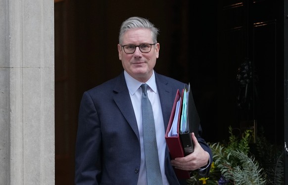 Britain's Prime Minister Keir Starmer leaves 10 Downing Street to attend the weekly Prime Ministers' Questions session in parliament in London, Wednesday, Feb. 25, 2026. (AP Photo/Kin Cheung ...