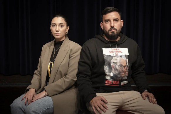 Shmuel Moha (r.) and Yuval Raphael, both survivors of the Hamas massacre in Kibbutzim Nirim, remember the fate of kidnapped Nadav Popplewell.