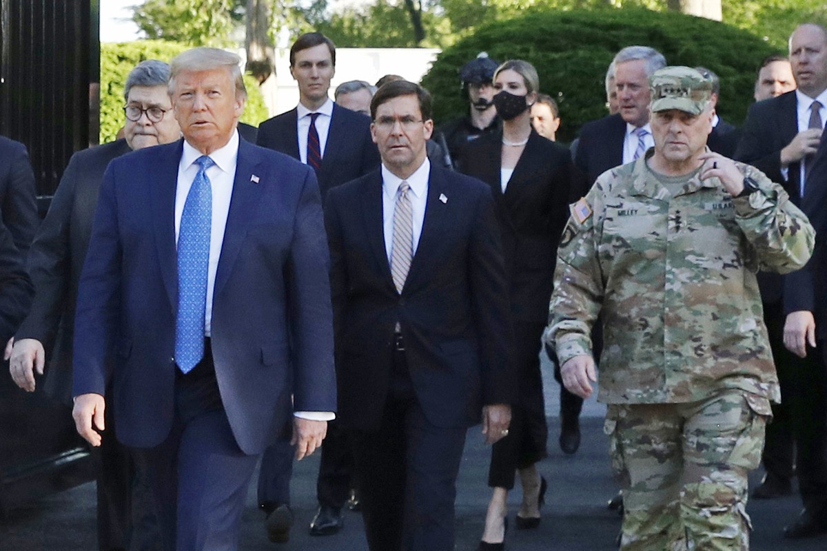 FILE - In this June 1, 2020 file photo, President Donald Trump departs the White House to visit outside St. John's Church, in Washington. Walking behind Trump from left are, Attorney General Will ...