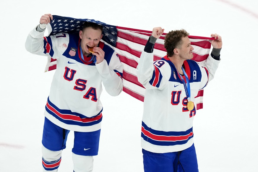 FILE - United States' Brady Tkachuk (7) and Matthew Tkachuk (19) celebrate after the United States' win over Canada in the men's ice hockey gold medal game at the 2026 Winter Olympics i ...