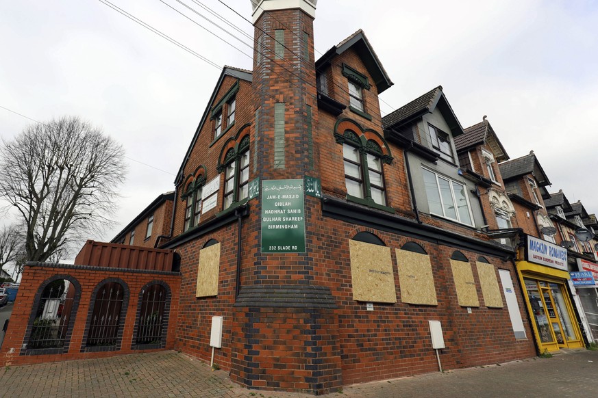 The mosque in Erdington, Birmingham, central England, Thursday March 21, 2019, with its windows boarded up after apparently being smashed with a sledgehammer. Counter-terrorism officers in central Eng ...