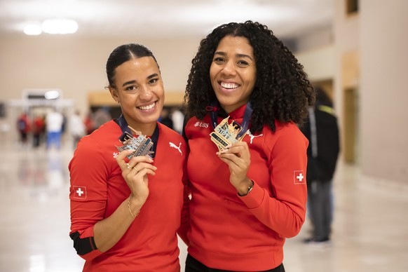 Gold medal winner Mujinga Kambundji of Switzerland, right, and her sister Bronze medal winner Ditaji Kambundji of Switzerland pose at the Team Hotel after the European Athletics Indoor Championships 2 ...