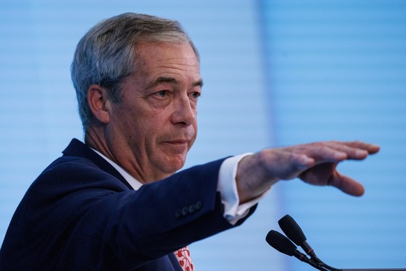 epa11647480 Leader of the Reform UK party Nigel Farage speaks at a press conference in London, Britain, 07 October 2024. MPs from the Reform UK party have indicated their intention to pursue a private ...
