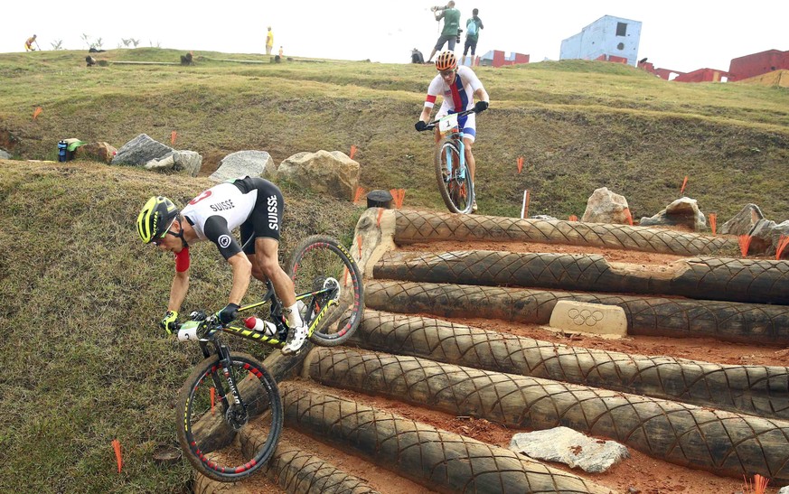 2016 Rio Olympics - Cycling mountain bike - Final - Men&#039;s Cross-country Race - Mountain Bike Centre - Rio de Janeiro, Brazil - 21/08/2016. Nino Schurter (SUI) of Switzerland and Jaroslav Kulhavy  ...