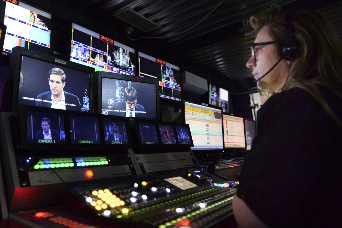 A journalist worka in a news room of the Dozhd (Rain) TV channel in Moscow, Russia, Friday, Aug. 20, 2021. Russian authorities have designated a top independent TV channel as a "foreign agent,&qu ...