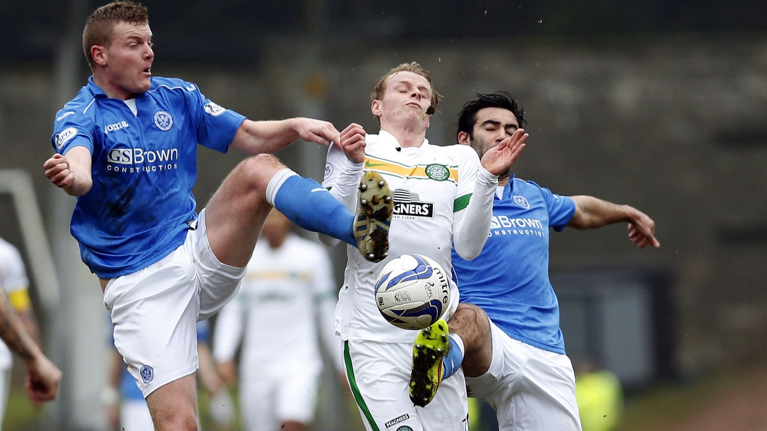 Celtic&#039;s Gary MacKay-Steven is challenged by St Johnstone&#039;s Simon Lappin (R) and Brian Easton during their Scottish Premier League soccer match at McDiarmid Park Stadium in Perth, Scotland,  ...