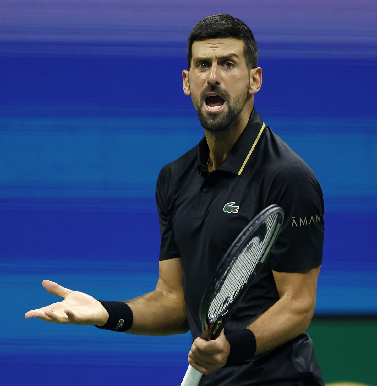 epa12335326 Novak Djokovic of Serbia reacts after losing a point against Cameron Norrie of Great Britain during the third round of the US Open Tennis Championships at the USTA Billie Jean King Nationa ...