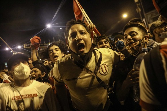 epa08823248 Citizens celebrate the resignation of Manuel Merino, the Interim President of Peru, in front of Congress in Lima, Peru, 15 November 2020. Manuel Merino announced on 15 November, his resign ...