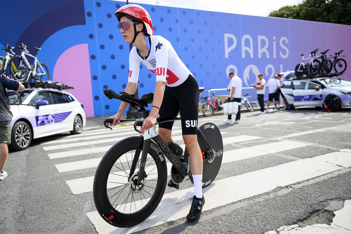Switzerland's cyclist Elena Hartmann rides her bike a the start of the official recognition of the time trial course prior the 2024 Paris Summer Olympics at the Invalides Olympic site in Paris, F ...