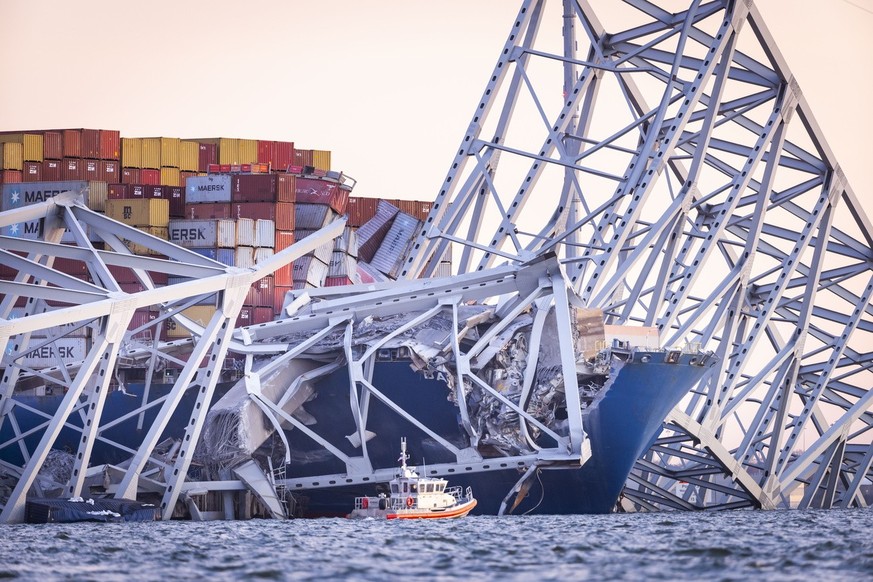 epa11244307 The Francis Scott Key Bridge rests partially collapsed after a cargo ship ran into it in Baltimore, Maryland, USA, 26 March 2024. The Maryland Department of Transportation confirmed that t ...