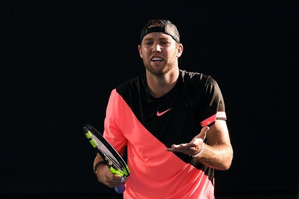 epa06439887 Jack Sock of the United States in action against Yuichi Sugita of Japan during round one of the Australian Open tennis tournament in Melbourne, Australia, 15 January 2018. EPA/LUKAS COCH A ...