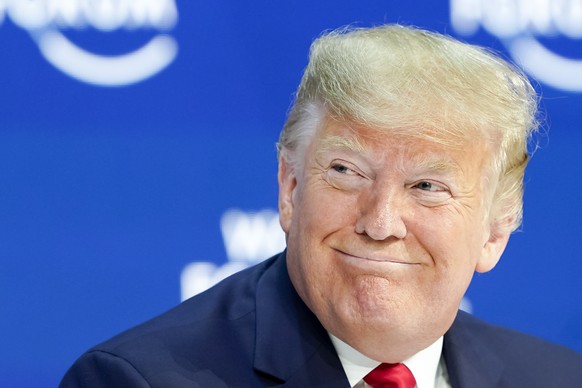 epa08146949 US President Donald J. Trump smiles before addressing a plenary session during the 50th annual meeting of the World Economic Forum (WEF) in Davos, Switzerland, 21 January 2020. The meeting ...