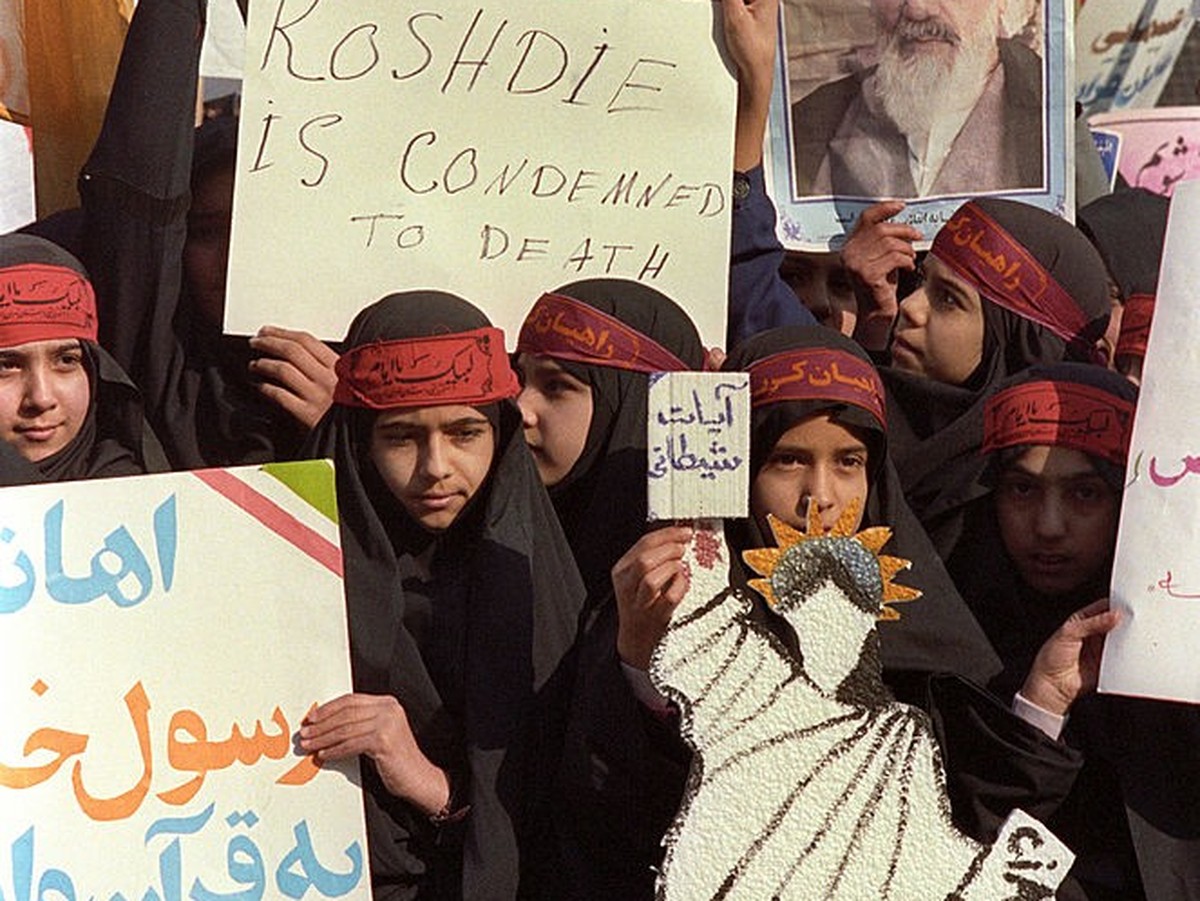 Girl demonstrators in Tehran call for the death of Indian-British writer Salman Rushdie after a fatwa was issued by Ayatollah Ruhollah Khomeini condemning him to death for blasphemy after the publicat ...