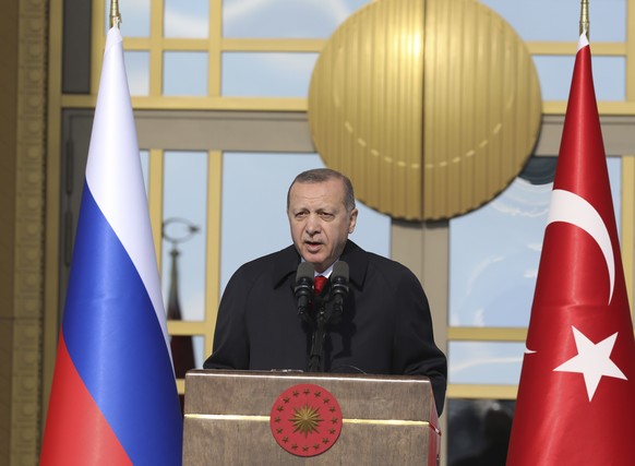 Turkey&#039;s President Recep Tayyip Erdogan talks during the welcome ceremony for Russia&#039;s President Vladimir Putin at the Presidential Palace in Ankara, Turkey, Tuesday, April 3, 2018. Turkey a ...