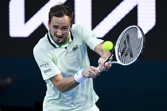 epa09709901 Daniil Medvedev of Russia in action against Felix Auger-Aliassime of Canada during their men&#039;s quarter final match of the Australian Open Grand Slam tennis tournament at Melbourne Par ...