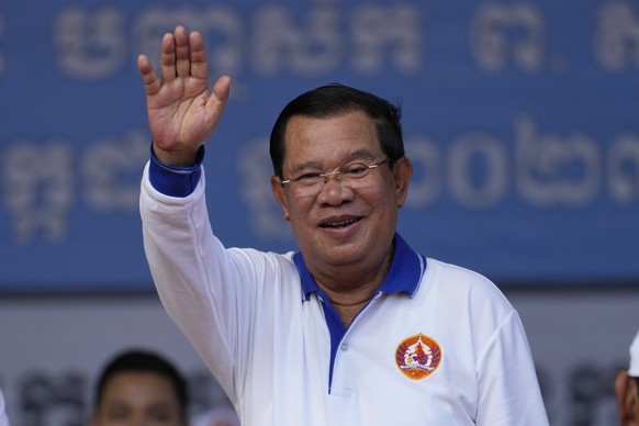 Cambodian Prime Minister Hun Sen, also chairman of the Cambodian People's Party, waves to his supporters during his party election campaign in Phnom Penh, Cambodia, Saturday, July 1, 2023. The three-w...