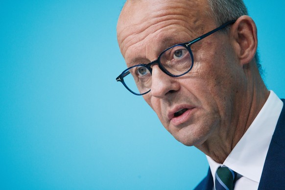 epa11620589 Chairman of the Christian Democratic Union (CDU) party and faction, Friedrich Merz, speaks during the press conference at the CDU headquarters following the election for the regional state ...