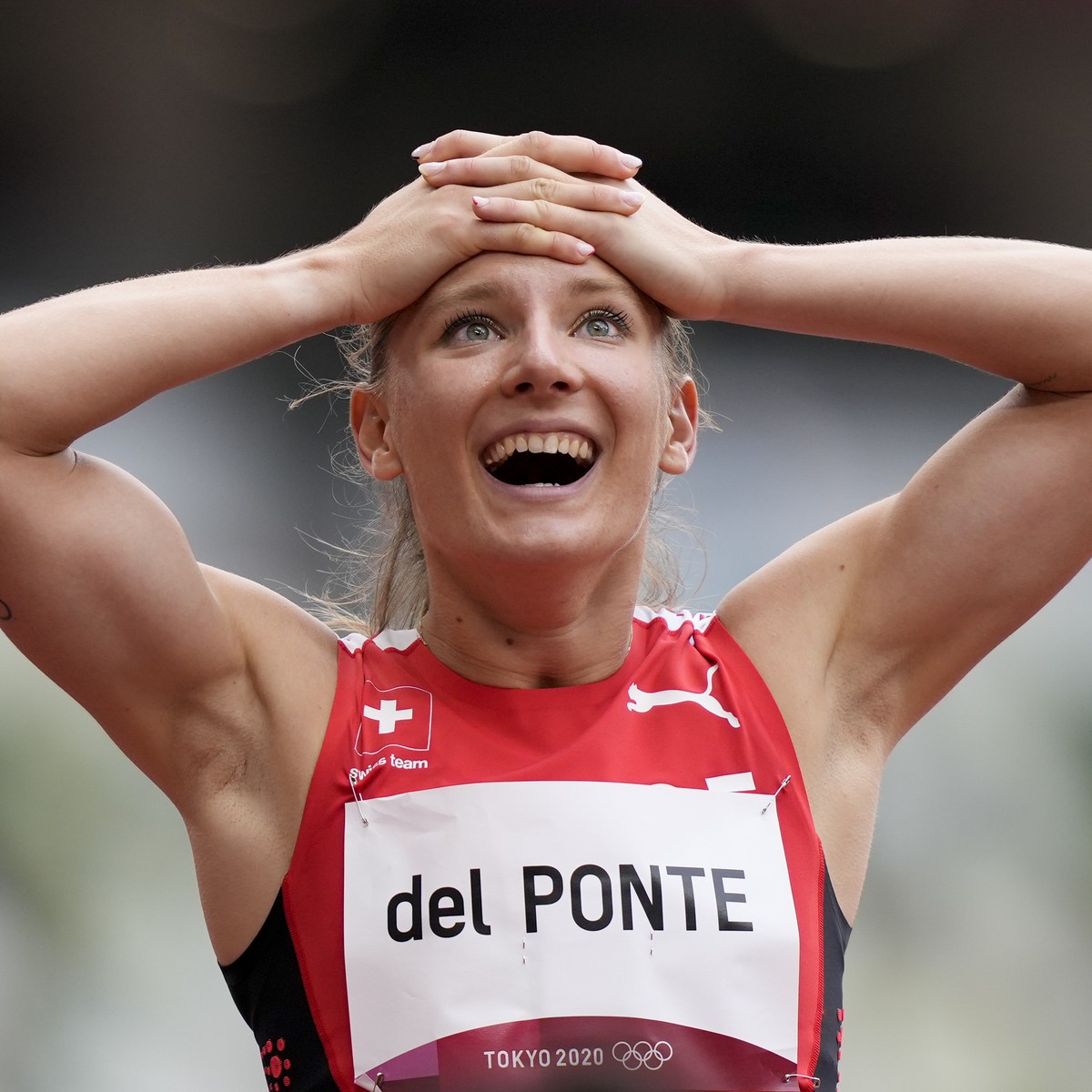 Ajla Del Ponte, of Switzerland, reacts after a heat in the women's 100-meter run at the 2020 Summer Olympics, Friday, July 30, 2021, in Tokyo. (AP Photo/Martin Meissner)