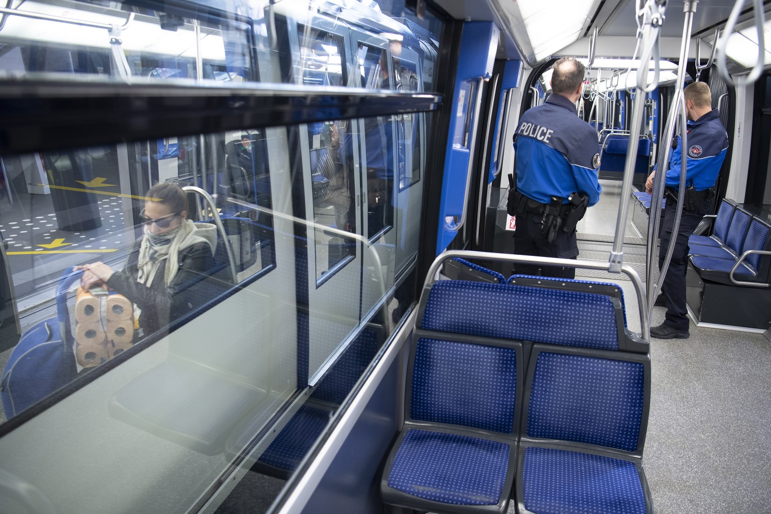 epa08328782 Lausanne&#039;s Police officers patrol in a TL Metro M2 or underground to prevent the gathering of more than 5 people during the state of emergency of the coronavirus disease (COVID-19) ou ...