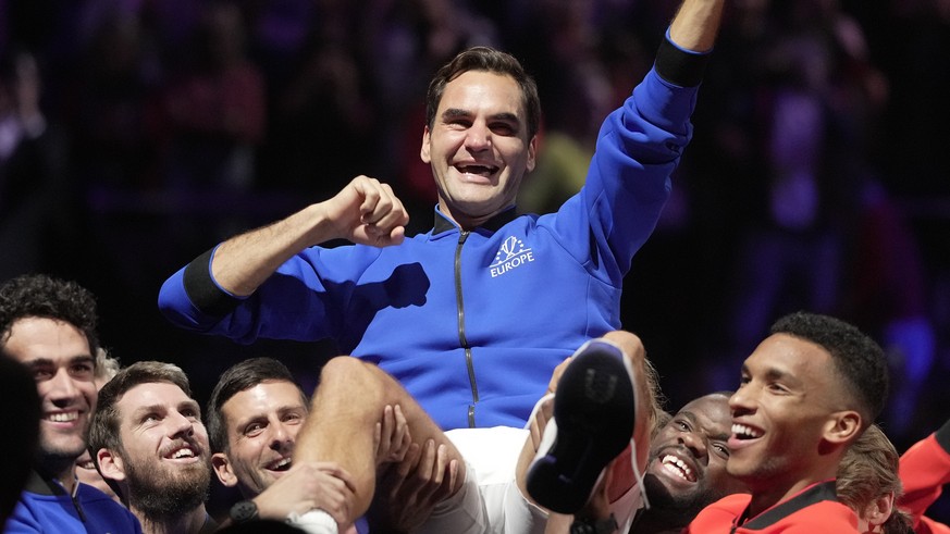Team Europe&#039;s Roger Federer is lifted by fellow players after playing with Rafael Nadal in a Laver Cup doubles match against Team World&#039;s Jack Sock and Frances Tiafoe at the O2 arena in Lond ...