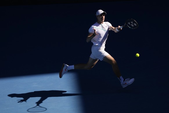 Denis Shapovalov of Canada plays a forehand return to Reilly Opelka of the U.S. during their third round match at the Australian Open tennis championships in Melbourne, Australia, Friday, Jan. 21, 2022. (AP Photo/Simon Baker)
Denis Shapovalov