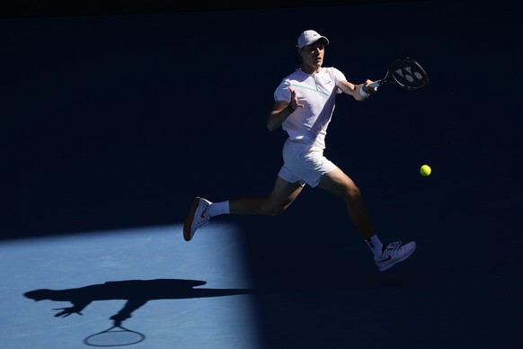 Denis Shapovalov of Canada plays a forehand return to Reilly Opelka of the U.S. during their third round match at the Australian Open tennis championships in Melbourne, Australia, Friday, Jan. 21, 202 ...